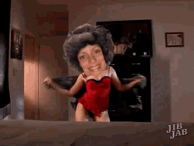 jib jab shows a woman in a red bodysuit dancing in a room