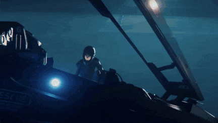 a blue tunnel with a light coming out of the end