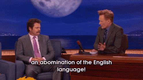 two men are sitting at a table with the words an abomination of the english language below them