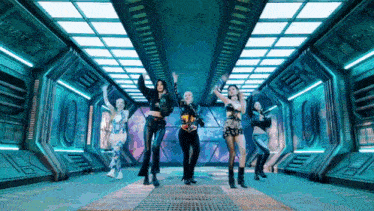 a group of women are dancing in a room with a sign on the wall that says pirate