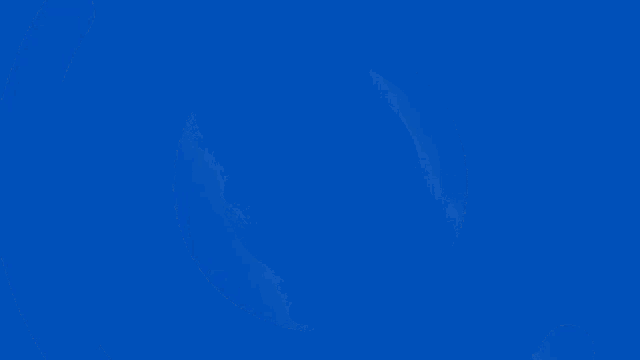 a blue circle in the middle of a dark purple background