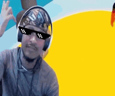 a man wearing sunglasses and headphones is giving the ok sign .