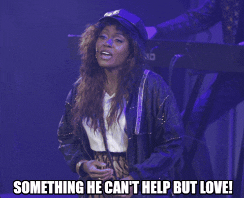 a woman in a hat says something he cant help but love