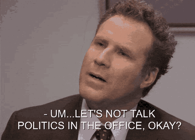 a man in a suit and tie is talking about politics in the office
