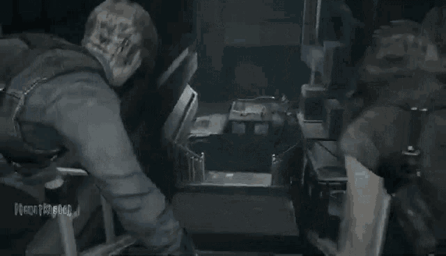 a man and a woman are standing next to each other in a dark room .