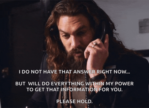 a man with a beard is talking on a phone