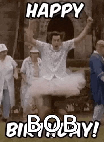 a man in a tutu is jumping in the air while a group of people are standing around him .
