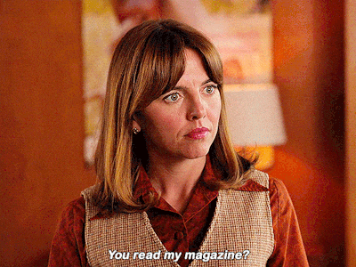 a woman says " you read my magazine " in a room