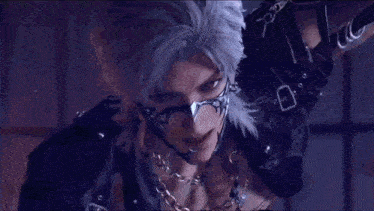 a man with white hair and a mask on his face says just a little more ..