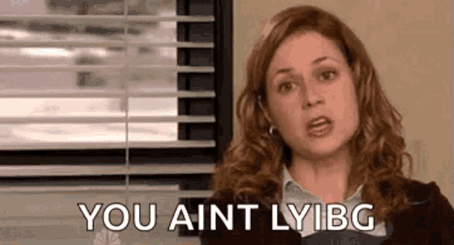 a woman from the office is sitting in front of a window and saying `` you ain 't lyibg '' .