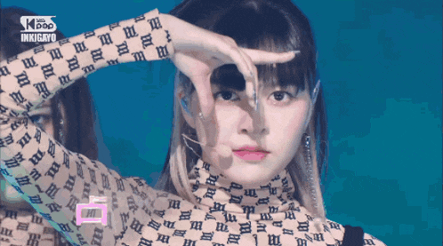 a girl wearing a turtleneck with letters on it