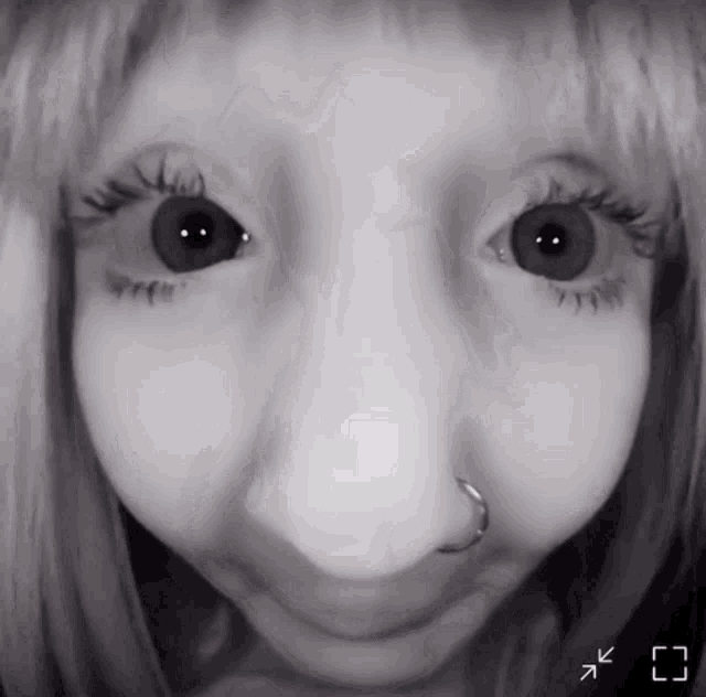 a close up of a person 's face with arrows pointing to the left
