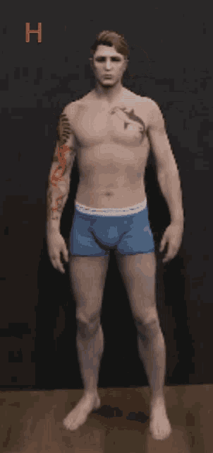 a man with a tattoo on his arm is wearing blue underwear with the letter h above him