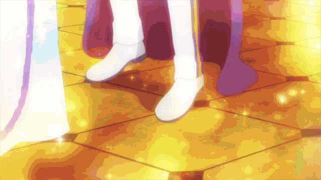 a couple of people standing next to each other on a gold tiled floor