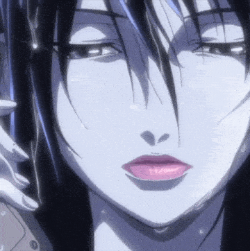 a close up of a woman 's face with a pink lip and black hair