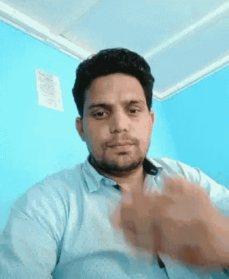 a man in a blue shirt is clapping his hands
