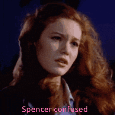 a close up of a woman 's face with the words spencer confused written below her