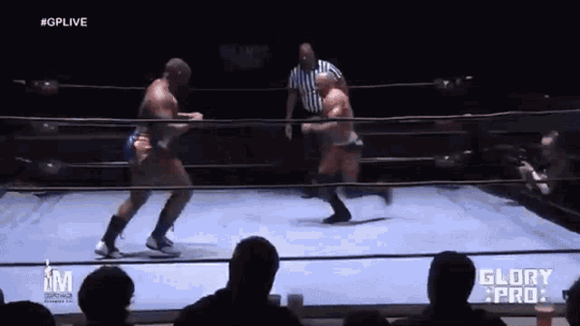 two men are fighting in a wrestling ring with the words glory pro on the bottom