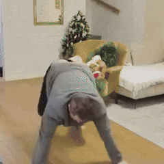a man is cleaning the floor in a living room