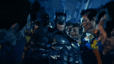 a close up of a man wearing a batman mask with the words " joker look " written below him