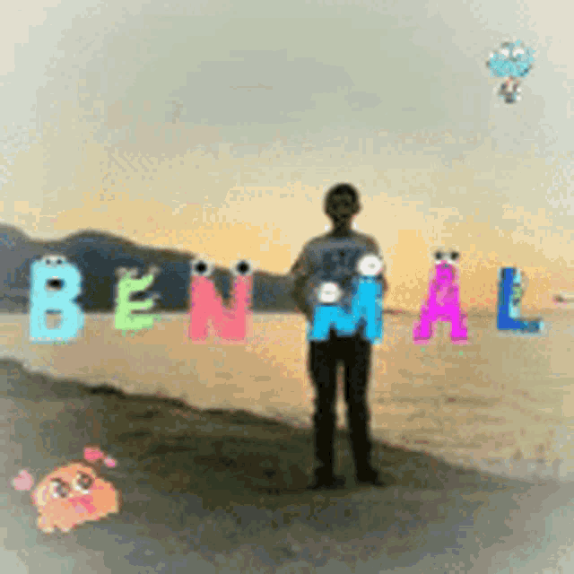 a man is standing on a beach with the name benal written on the beach