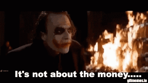 the joker says it 's not about the money in front of a burning building