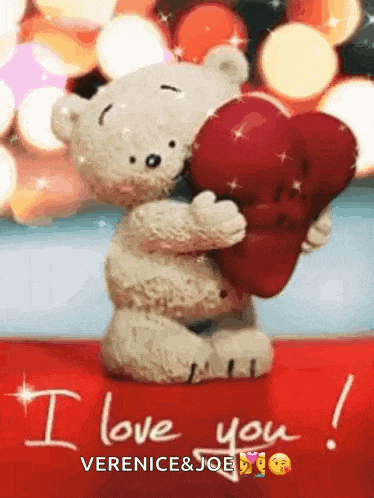 a teddy bear holding a red heart with the words i love you written on the bottom