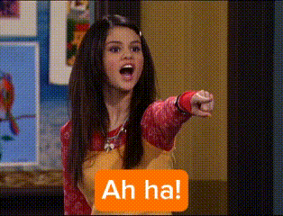 a girl is pointing at the camera with a sign that says " ah ha "
