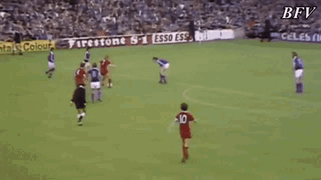 a blurry picture of a soccer field with a goal in the background