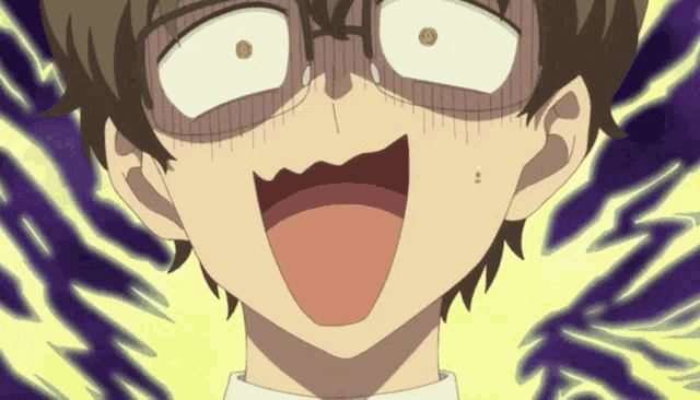 a close up of a person 's face with a surprised look on their face