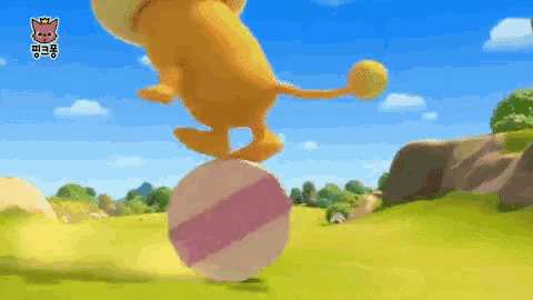 a cartoon lion is balancing on a ball in a field .