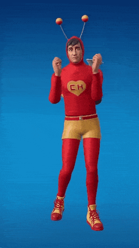 a man in a red and yellow superhero costume with a heart on his chest is standing in front of a blue background .