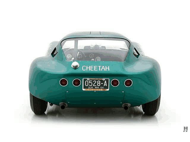 a green cheetah car with a license plate that says 0528-a