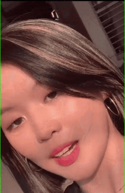 a close up of a woman 's face with her eyes closed