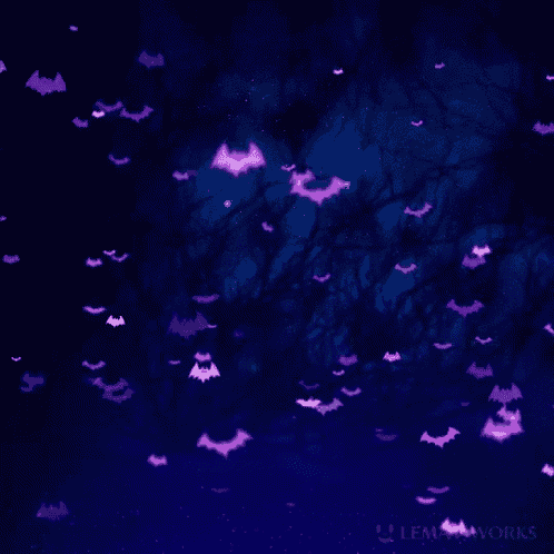 a bunch of purple bats are flying in the air