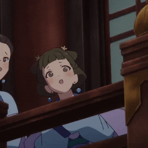 a woman with a flower in her hair is sitting on a railing