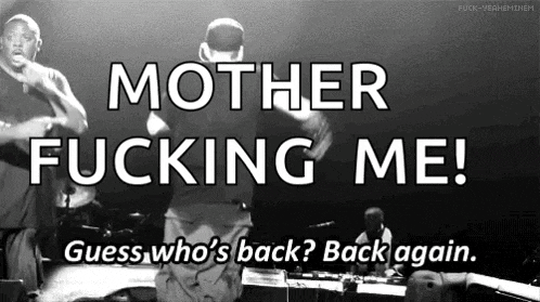 a black and white photo of two men on stage with the words mother fucking me guess who 's back back again