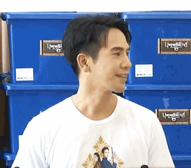 a man wearing a white t-shirt with a picture of a couple on it