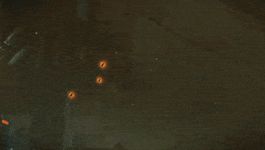 a robot is shooting a rocket at a building