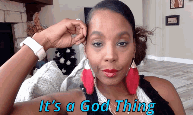 a woman wearing red earrings says it 's a good thing