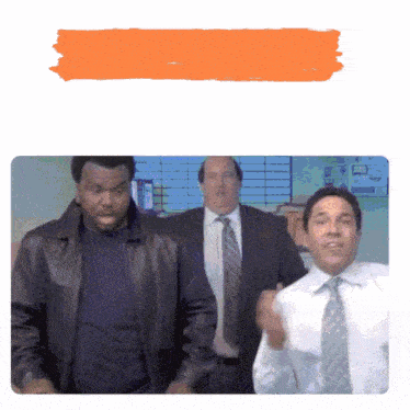 a group of men in suits and ties are dancing together