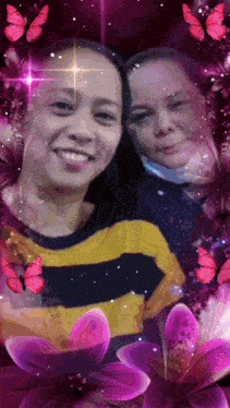 two women are posing for a picture with pink butterflies surrounding them