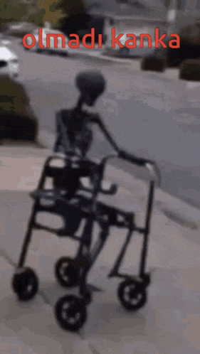 a skeleton is pushing a walker with the words olmadi kanka written on the bottom