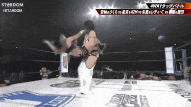 a wrestling match between azm and c is being shown on stardom