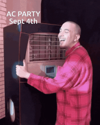 a man in a red plaid shirt is laughing in front of an air conditioner that says ac party sept 4th on it