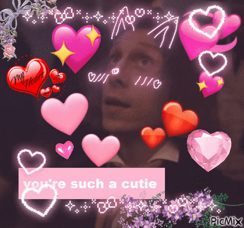 a picture of a man surrounded by pink hearts with the words " you 're such a cutie " at the bottom