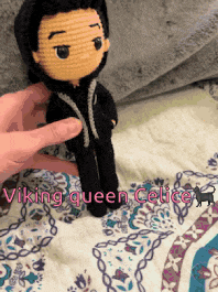 a person is holding a crocheted doll that says viking queen celice on the bottom