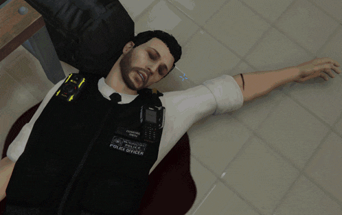 a man in a police uniform is laying on the ground with his head on his hand