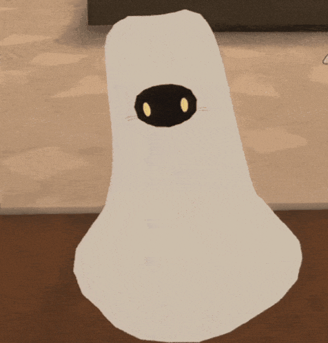 a white object with a black nose and eyes