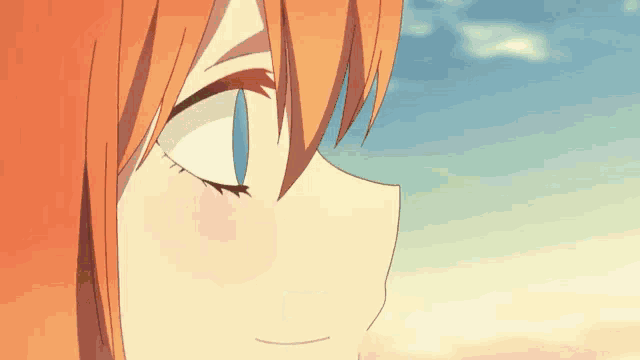 a close up of a girl 's face with a blue sky in the background